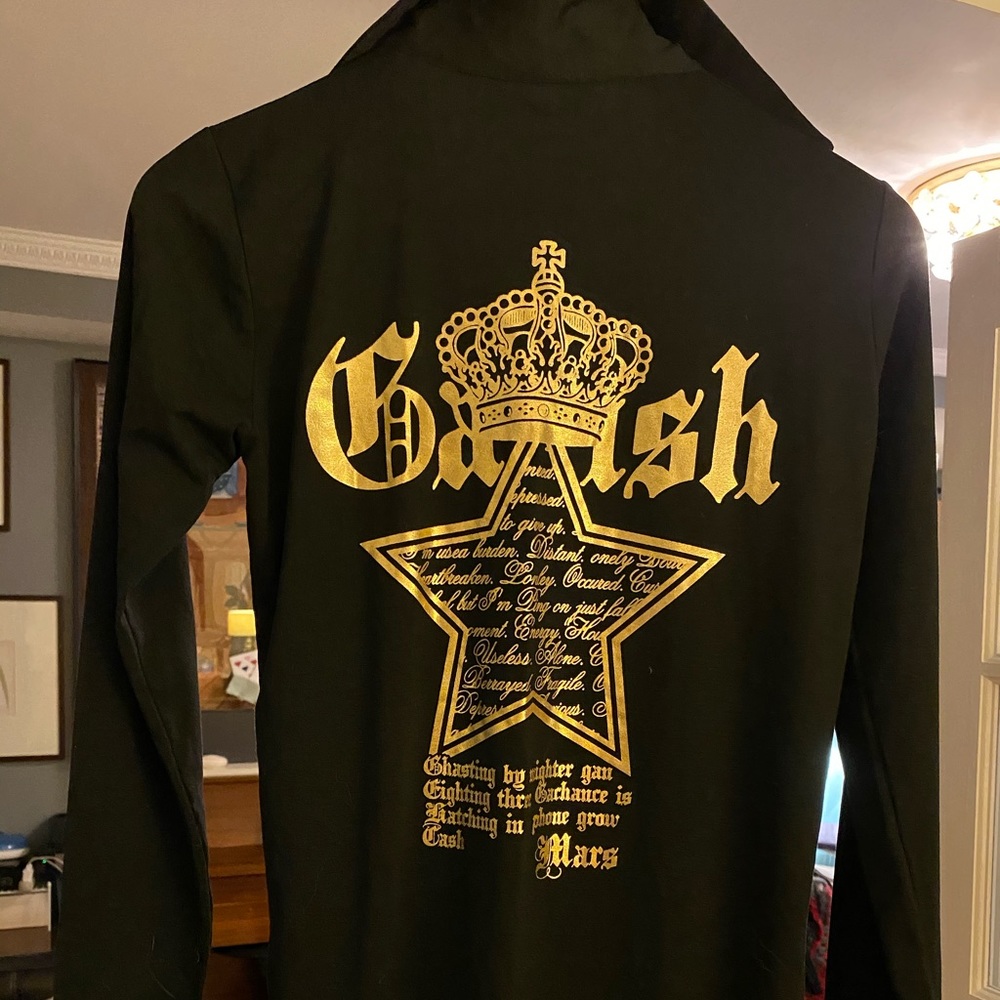 Black shirt with gold pattern. new